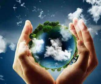 Hands holding the earth graphic